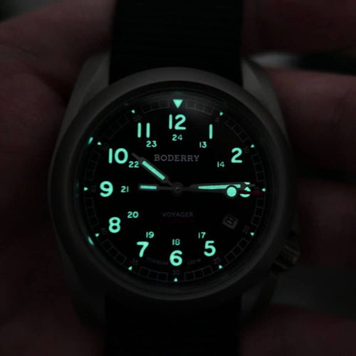 Boderry Voyager lume shot showing glowing numerals and hands in low light